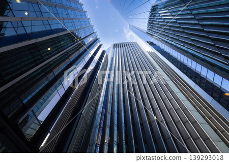 Looking up at tall corporate buildings in financial district Looking up at tall corporate buildings in financial district 139293018