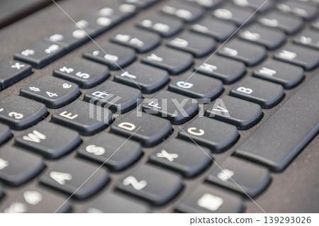 Close up view of a modern black laptop keyboard Close up view of a modern black laptop keyboard 139293026
