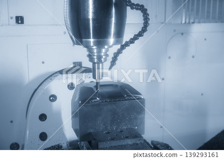 High-precision 5-axis CNC milling machine finishing a press die part with a ball nose end mill. High-precision 5-axis CNC milling machine finishing a press die part with a ball nose end mill. 139293161