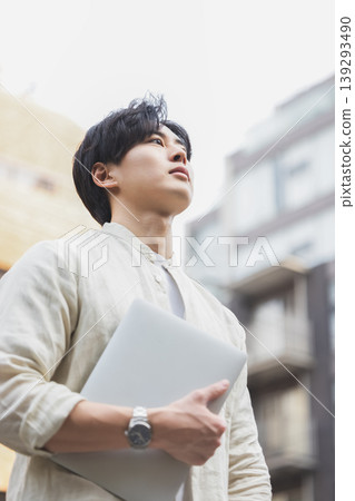 A young man with a laptop A young man with a laptop 139293490