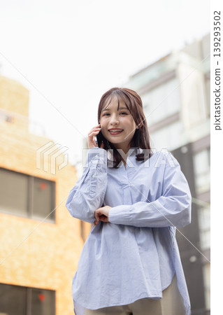 A woman making a phone call A woman making a phone call 139293502