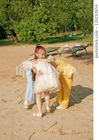 Funny kids hug, have fun playing together in the park. World Children's Day. Funny kids hug, have fun playing together in the park. World Children's Day. 139293654