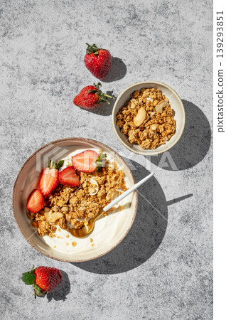 Healthy yogurt bowl with granola and fresh berries for clean eating diet 139293851