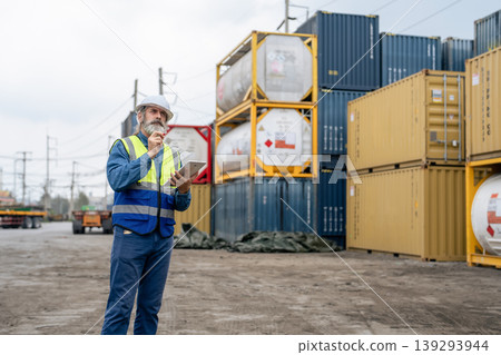 Engineers Inspect Cargo Shipment at Container Yard, Logistics Concept. Engineers Inspect Cargo Shipment at Container Yard, Logistics Concept. 139293944