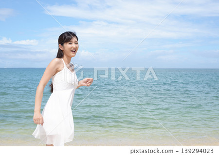 A woman relaxing on a beautiful tropical beach A woman relaxing on a beautiful tropical beach 139294023