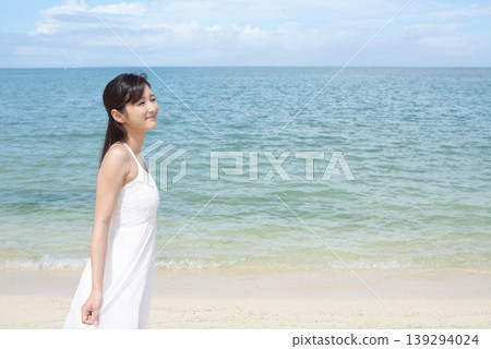 A woman relaxing on a beautiful tropical beach A woman relaxing on a beautiful tropical beach 139294024