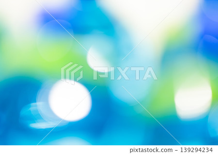 Abstract blue and green bokeh background with glowing white circles and soft defocused light effect Abstract blue and green bokeh background with glowing white circles and soft defocused light effect 139294234