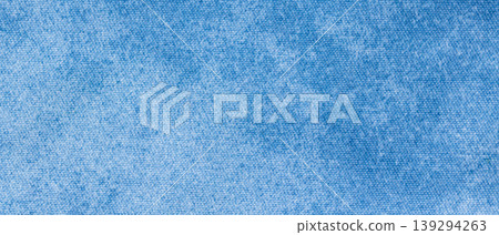 Light blue denim chambray fabric texture with fine woven surface as a background 139294263