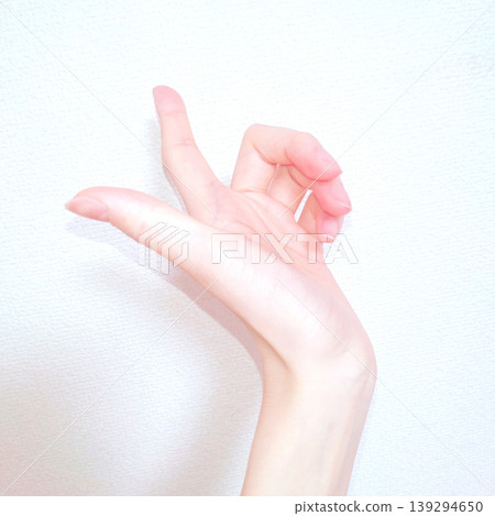 Beautiful and graceful female hand parts that stand out against a white background. 139294650