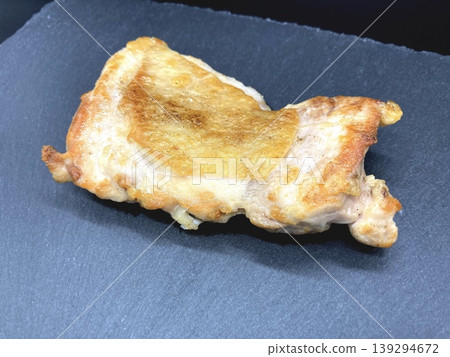 Image of teriyaki chicken on a slate plate. Image of teriyaki chicken on a slate plate. 139294672