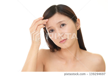 Female suffering from rough skin Female suffering from rough skin 139294697