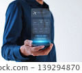 Businessman are booking airline tickets online via virtual smartphones. 139294870