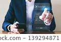 Business people are booking airline tickets online via virtual smartphones. 139294871