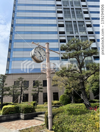 The modern buildings of the Takeshiba area and the blue sky. The Tokyo Bayside cityscape viewed from the wooden deck. 139294906