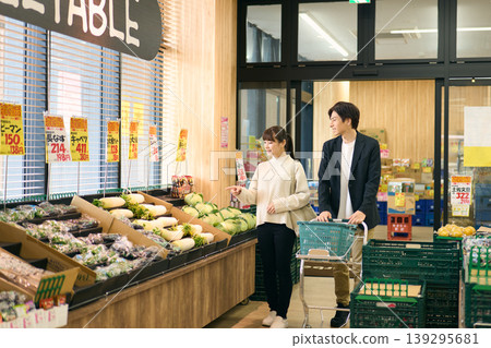 A couple shopping at a supermarket A couple shopping at a supermarket 139295681