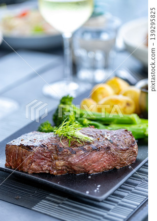 A vertical photo focusing on sirloin steak. A vertical photo focusing on sirloin steak. 139295825