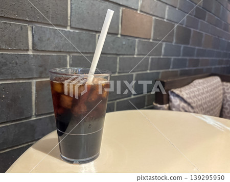 Iced coffee and brick-patterned wall Iced coffee and brick-patterned wall 139295950
