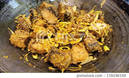 Stir-Fried Fish with Turmeric and Lemongrass in a Traditional Wok Stir-Fried Fish with Turmeric and Lemongrass in a Traditional Wok 139296589