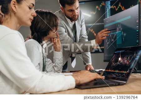 Important data on the screen. Business people are working with stock market exchange in office Important data on the screen. Business people are working with stock market exchange in office 139296764
