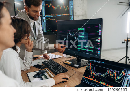 Important data on the screen. Business people are working with stock market exchange in office Important data on the screen. Business people are working with stock market exchange in office 139296765