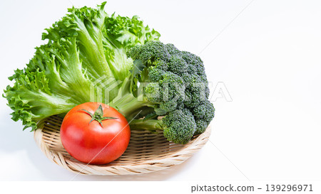 Assorted salad vegetables: fresh lettuce, broccoli, and tomatoes against a white background. Assorted salad vegetables: fresh lettuce, broccoli, and tomatoes against a white background. 139296971