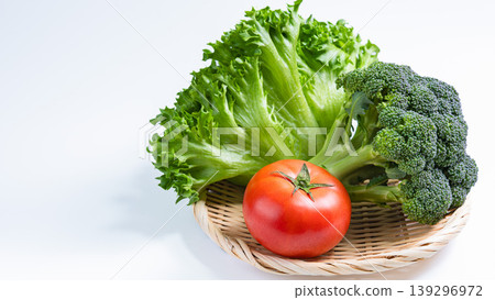 Assorted salad vegetables: fresh lettuce, broccoli, and tomatoes against a white background. Assorted salad vegetables: fresh lettuce, broccoli, and tomatoes against a white background. 139296972
