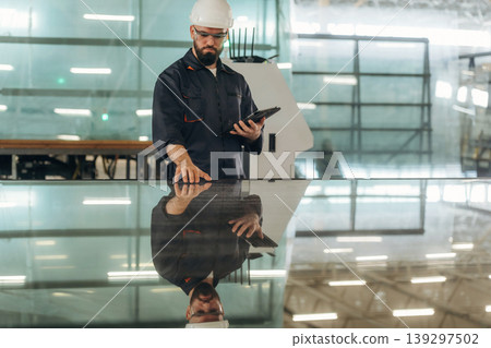 Big storage area, Warehouse worker in an industrial environment of a factory Big storage area, Warehouse worker in an industrial environment of a factory 139297502