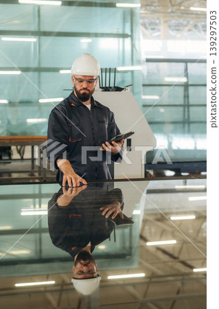 Big storage area, Warehouse worker in an industrial environment of a factory Big storage area, Warehouse worker in an industrial environment of a factory 139297503