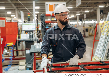Warehouse worker in an industrial environment of a factory or storage area 139297508