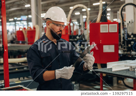 Important data, reading. Warehouse worker in an industrial environment of a factory or storage area 139297515
