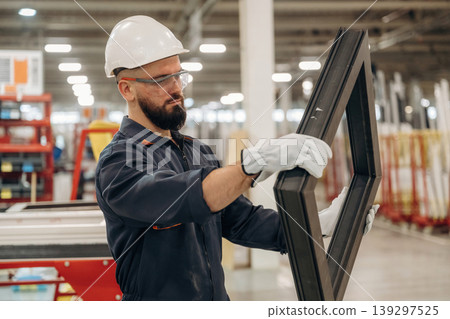 Border for small window, without glass. Warehouse worker in an industrial environment of a factory or storage area Border for small window, without glass. Warehouse worker in an industrial environment of a factory or storage area 139297525