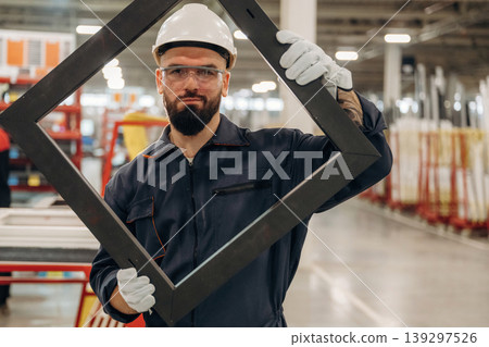Border for small window, without glass. Warehouse worker in an industrial environment of a factory or storage area Border for small window, without glass. Warehouse worker in an industrial environment of a factory or storage area 139297526