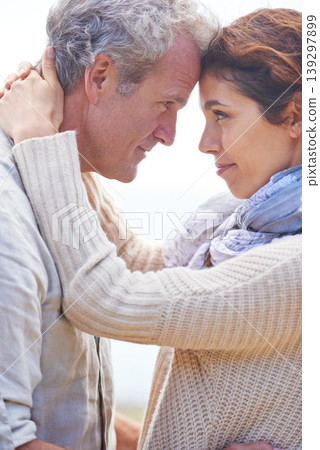 Couple, face and smile outdoor with hug for romance, love and relationship in nature with date. Mature, man and woman or embrace with happy, marriage and joyful for bonding, honeymoon and support 139297899
