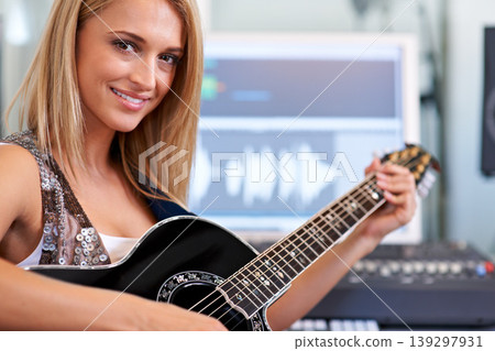 Portrait, relax and woman with a guitar, music and concert practice in a recording studio for performance. Person, girl or artist with string instrument, smile or playing song with talent inspiration Portrait, relax and woman with a guitar, music and concert practice in a recording studio for performance. Person, girl or artist with string instrument, smile or playing song with talent inspiration 139297931