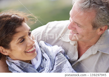Couple, face and laughing in nature with hug for romance, love and relationship outdoor with date. Mature, man and woman or embrace with happy, marriage and joyful for bonding, honeymoon and support 139297945