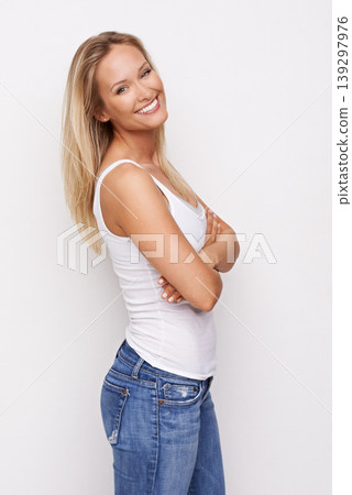 Happy, fashion and portrait of woman with crossed arms in studio for confidence, pride and attractive. Jeans, smile and isolated person in casual clothes, trendy outfit and style on white background Happy, fashion and portrait of woman with crossed arms in studio for confidence, pride and attractive. Jeans, smile and isolated person in casual clothes, trendy outfit and style on white background 139297976