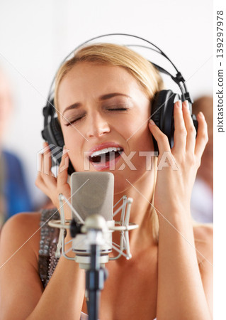 Music, recording studio and woman with microphone, headphones and band performance with talent. Singing, art and happy girl musician live streaming voice for record label, sound and audio broadcast. Music, recording studio and woman with microphone, headphones and band performance with talent. Singing, art and happy girl musician live streaming voice for record label, sound and audio broadcast. 139297978