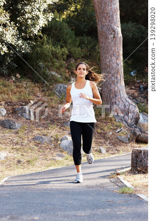 Running, health and path with woman in nature for fitness, speed and cardio challenge. Wellness, sports and workout with female runner training in road outdoor for exercise, fast and performance Running, health and path with woman in nature for fitness, speed and cardio challenge. Wellness, sports and workout with female runner training in road outdoor for exercise, fast and performance 139298020