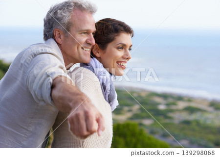 Mature couple, happy and outdoor on vacation, airplane hands and weekend for enjoying holiday. Man, woman and bonding together with smile, marriage and commitment with affection, seaside and joyful Mature couple, happy and outdoor on vacation, airplane hands and weekend for enjoying holiday. Man, woman and bonding together with smile, marriage and commitment with affection, seaside and joyful 139298068