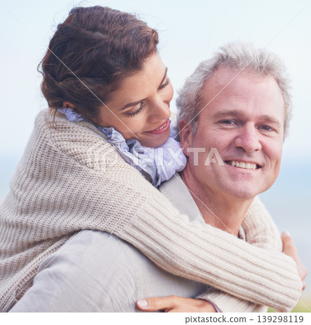 Mature couple, love and piggy back in outdoor, romantic and happiness for holiday fun. Man, woman and bonding together with smile, marriage and commitment with affection, joyful and blue skies Mature couple, love and piggy back in outdoor, romantic and happiness for holiday fun. Man, woman and bonding together with smile, marriage and commitment with affection, joyful and blue skies 139298119