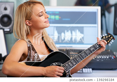 Woman, guitar and creative in recording studio for music with smile, ideas and computer for art, album or song. Musician, artist and instrument with pc for sound, audio and happy for entertainment Woman, guitar and creative in recording studio for music with smile, ideas and computer for art, album or song. Musician, artist and instrument with pc for sound, audio and happy for entertainment 139298184
