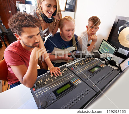 Recording studio, music and people with producer for band songs, track and audio with musical instruments. Technology, soundboard and men and women with sound engineer or technician to record media 139298263