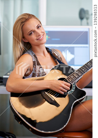 Woman, guitar and portrait in recording studio for music with smile, creative and computer for art, album or song. Musician, artist and instrument with pc for sound, audio and happy for entertainment Woman, guitar and portrait in recording studio for music with smile, creative and computer for art, album or song. Musician, artist and instrument with pc for sound, audio and happy for entertainment 139298313