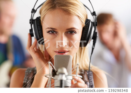 Music studio, portrait and woman with microphone, headphones and band performance with talent. Singing, art and face of girl musician live streaming voice for record label, sound and audio broadcast. 139298348