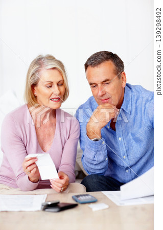 Home, finance and old couple with documents, savings or mortgage debt with insurance checklist, taxes or asset management. Apartment, senior woman or mature man with paperwork, budget or retirement 139298492
