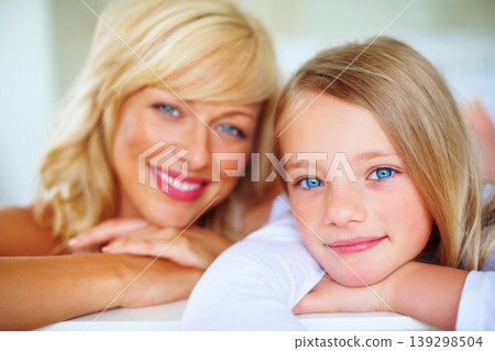 Happy, portrait and mother with girl on bed for bonding, relaxing and spending time together. Smile, love and young mom chilling and resting with kid or child from Australia in bedroom of family home Happy, portrait and mother with girl on bed for bonding, relaxing and spending time together. Smile, love and young mom chilling and resting with kid or child from Australia in bedroom of family home 139298504