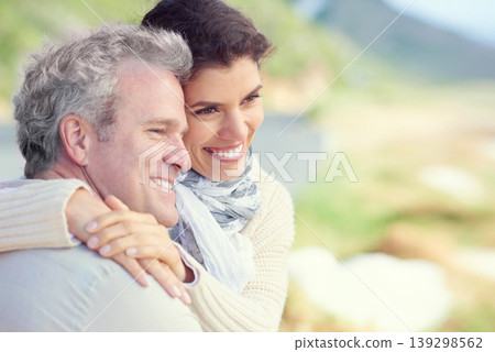 Couple, face and smile outdoor with hug for romance, love and relationship in nature with comfort. Mature, man and woman or embrace with happy, relax and peace for bonding, honeymoon and support 139298562