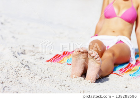 Woman, feet and bikini at beach, relax and sand for sunshine, summer and mockup space with towel. Girl, freedom and outdoor for vacation, holiday or color for sunbathing, health or wellness in Naples 139298596