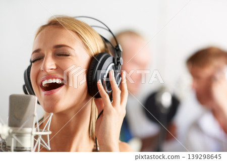 Music, singing and woman with microphone, headphones and band performance with talent. Recording studio, smile and happy girl musician live streaming voice for record label, sound and audio broadcast Music, singing and woman with microphone, headphones and band performance with talent. Recording studio, smile and happy girl musician live streaming voice for record label, sound and audio broadcast 139298645