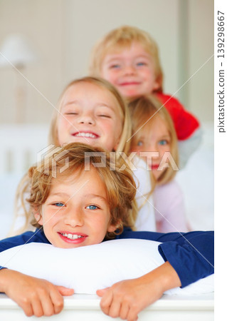 Portrait, smile or love with brother and sister sibling children on a bed in their home together. Family, happy or bonding with young boy and girl kids in the bedroom of an apartment on the weekend Portrait, smile or love with brother and sister sibling children on a bed in their home together. Family, happy or bonding with young boy and girl kids in the bedroom of an apartment on the weekend 139298667